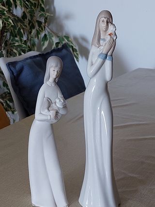 2 figuras porcelana niña gato y perrito
