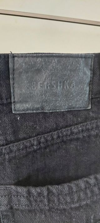 Shorts jeans neri strappati