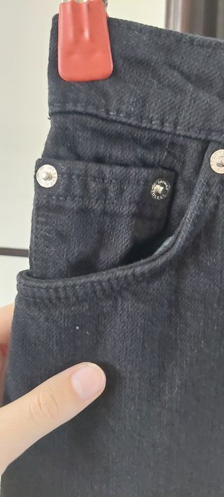 Shorts jeans neri strappati