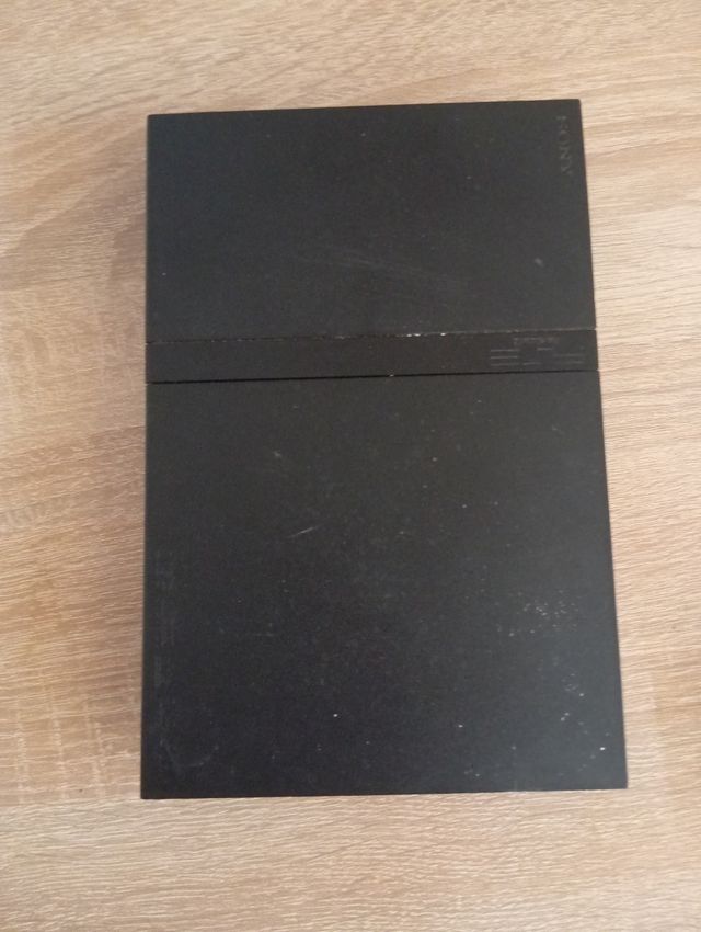 PlayStation 2 con 4juegos i un mando