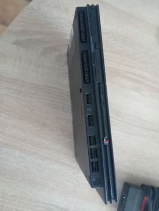 PlayStation 2 con 4juegos i un mando