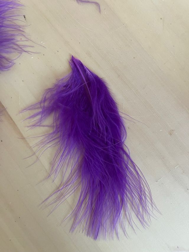 Tira plumas 1m. Tupidas. Largo 12cm. morado