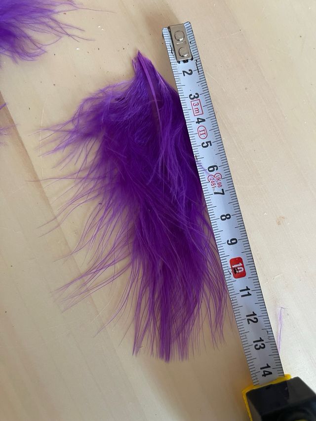 Tira plumas 1m. Tupidas. Largo 12cm. morado