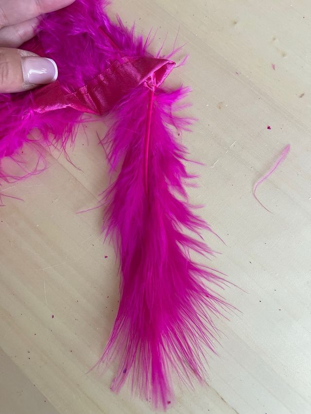 Tira plumas natura 1m. Tupidas. Largo 12cm. fucsia