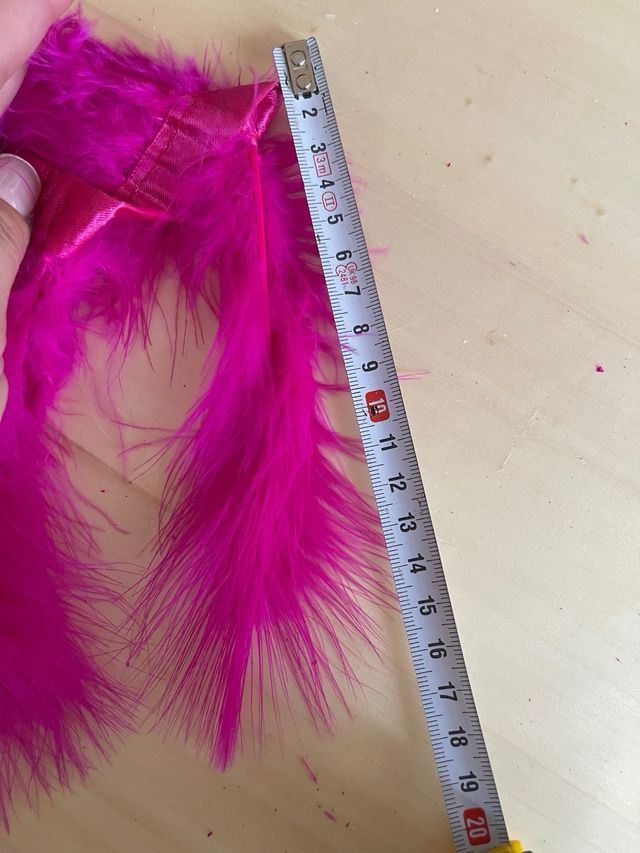 Tira plumas natura 1m. Tupidas. Largo 12cm. fucsia