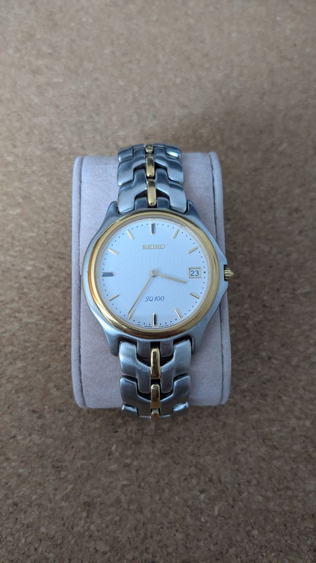 Reloj Seiko SQ100 vintage bi-tono