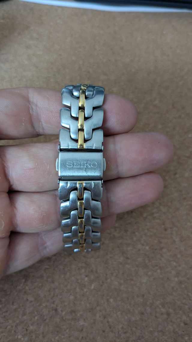 Reloj Seiko SQ100 vintage bi-tono