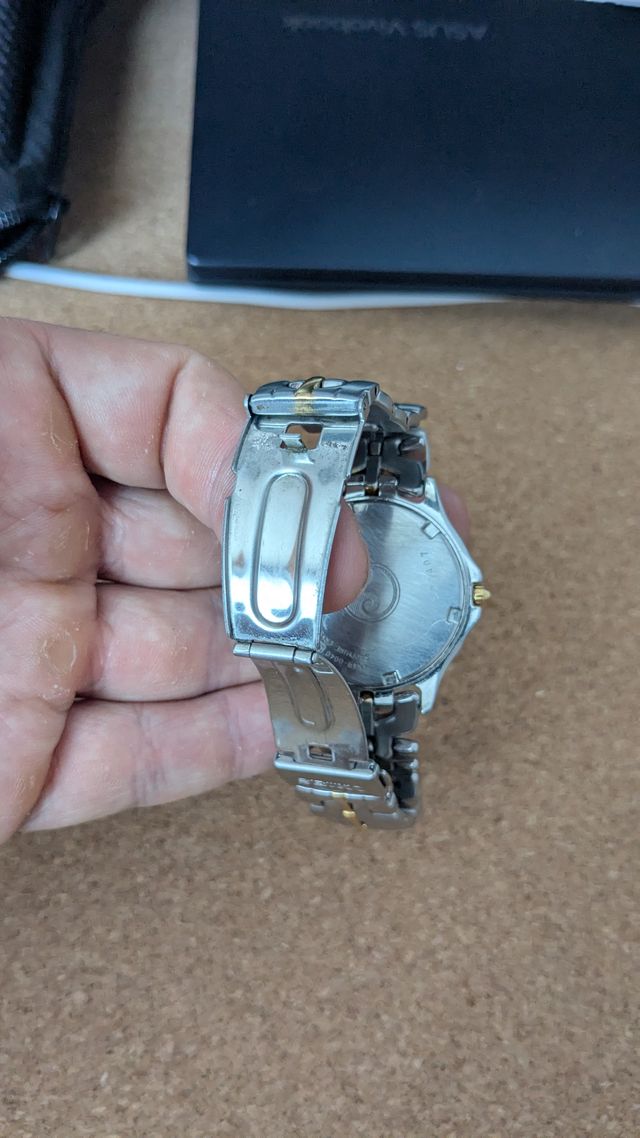 Reloj Seiko SQ100 vintage bi-tono