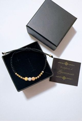 Braccialetto con cordoncino nero e oro 18kt 750