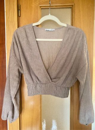 Top beige manga larga T. S