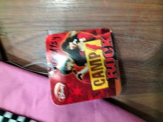 Mochila bandolera rock negra y rosa