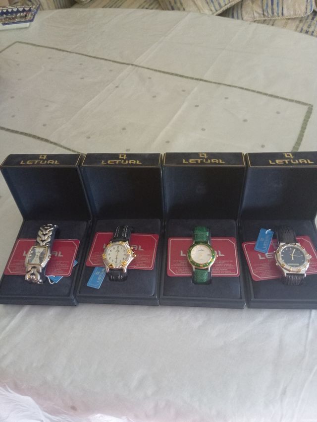 4 Relojes Letual dorados y plateados