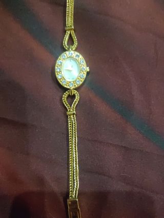 Rebaja Pulsera forma Reloj dorado y circonitas 