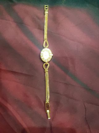 Rebaja Pulsera forma Reloj dorado y circonitas 