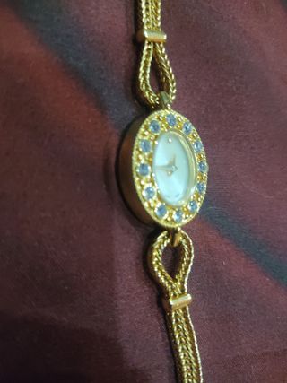 Rebaja Pulsera forma Reloj dorado y circonitas 