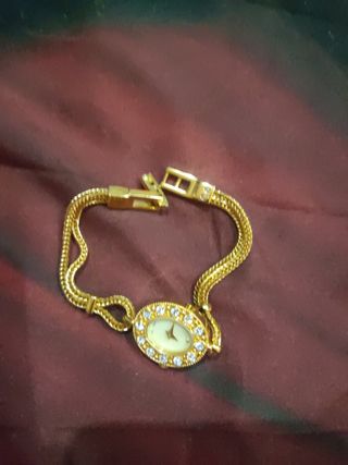 Rebaja Pulsera forma Reloj dorado y circonitas 