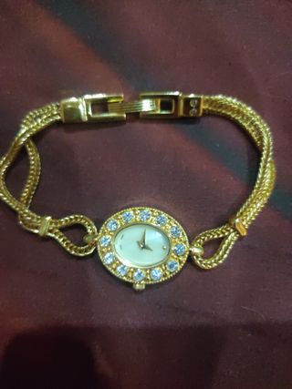 Rebaja Pulsera forma Reloj dorado y circonitas 