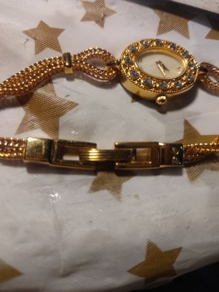 Rebaja Pulsera forma Reloj dorado y circonitas 