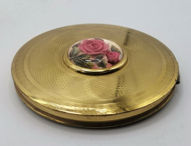 Antigua polvorera metálica con espejo England