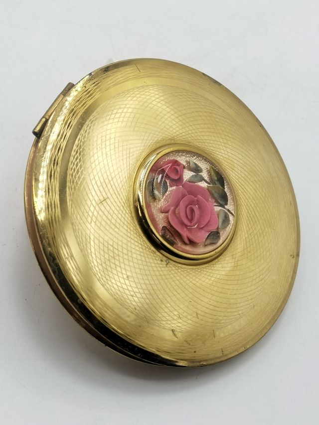 Antigua polvorera metálica con espejo England