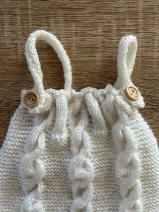 Pagliaccetto neonato lavorato a maglia