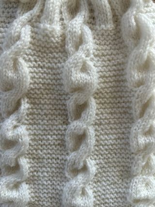 Pagliaccetto neonato lavorato a maglia