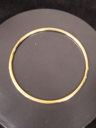 Pulsera oro 18k  rígida y maciza .7 cm diámetro 