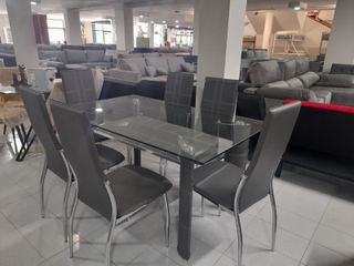 mesa de crital + 6 sillass en polipiel nuevas
