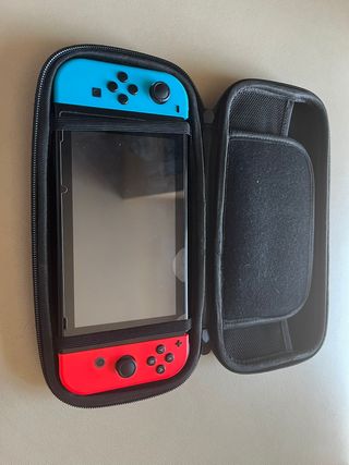Nintendo Switch rojo y azul + accesorios y juegos