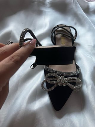 Scarpe nere con fiocco glitter