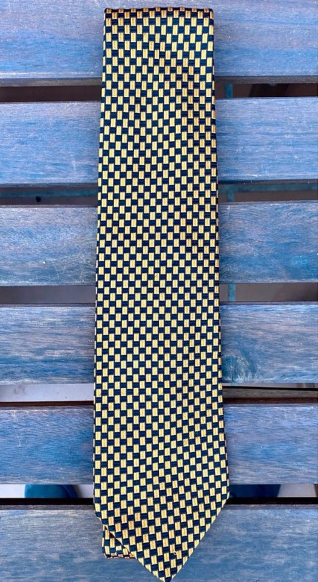 Corbata seda cuadros negro-naranja con apenas uso.
