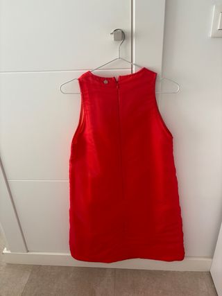 Vestido naranja fiesta con flor
