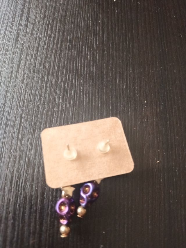 Pendientes calaveras dorados y morados