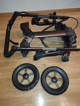 Carrito bebé Concord Neo color naranja  y marrón.