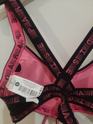 Top sujetador deportivo negro y fucsia