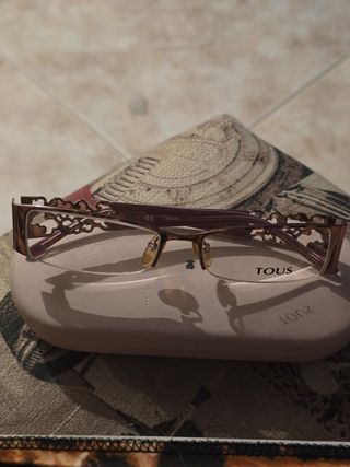 Montura de gafas Tous doradas y moradas