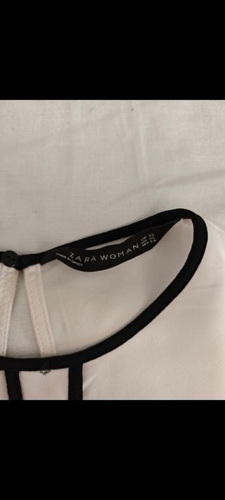 Blusa blanca c/ ribete negro