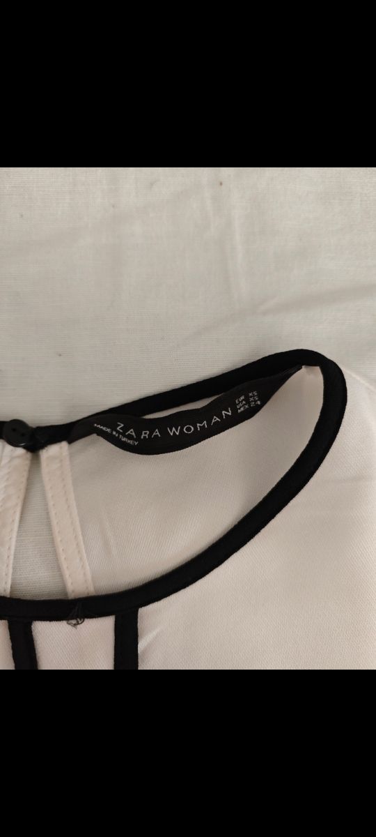 Blusa blanca c/ ribete negro