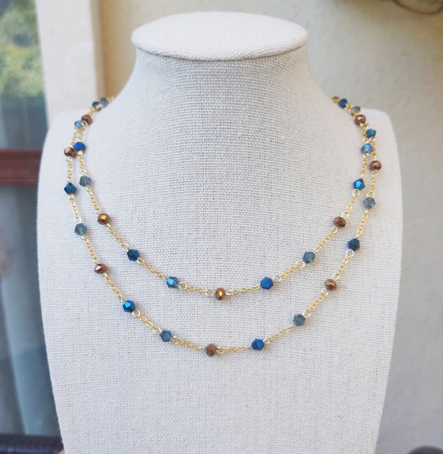 Collana dorata cristalli blu e bronzo