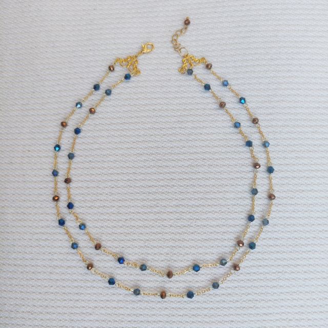 Collana dorata cristalli blu e bronzo