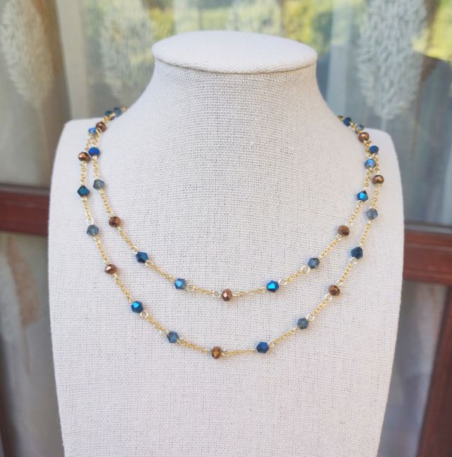 Collana dorata cristalli blu e bronzo