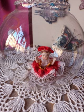 Muñeca veneciana en pecera