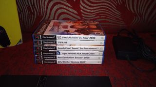PlayStation 2 con caja y juegos 