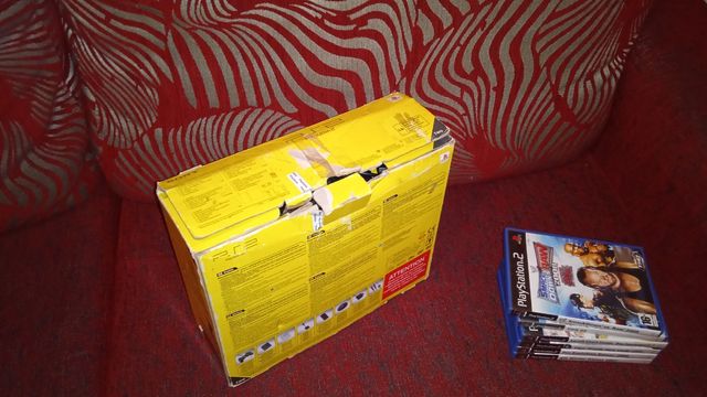 PlayStation 2 con scatola e giochi