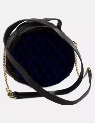 Bolso redondo con terciopelo azul