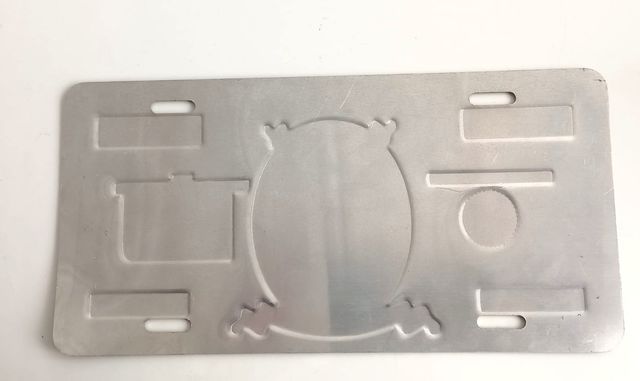 Placa decorativa US$1M metálica