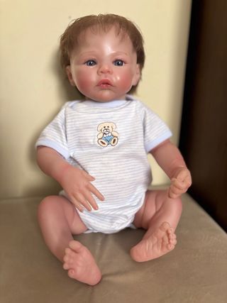 Muñeco bebé niña con biberon 