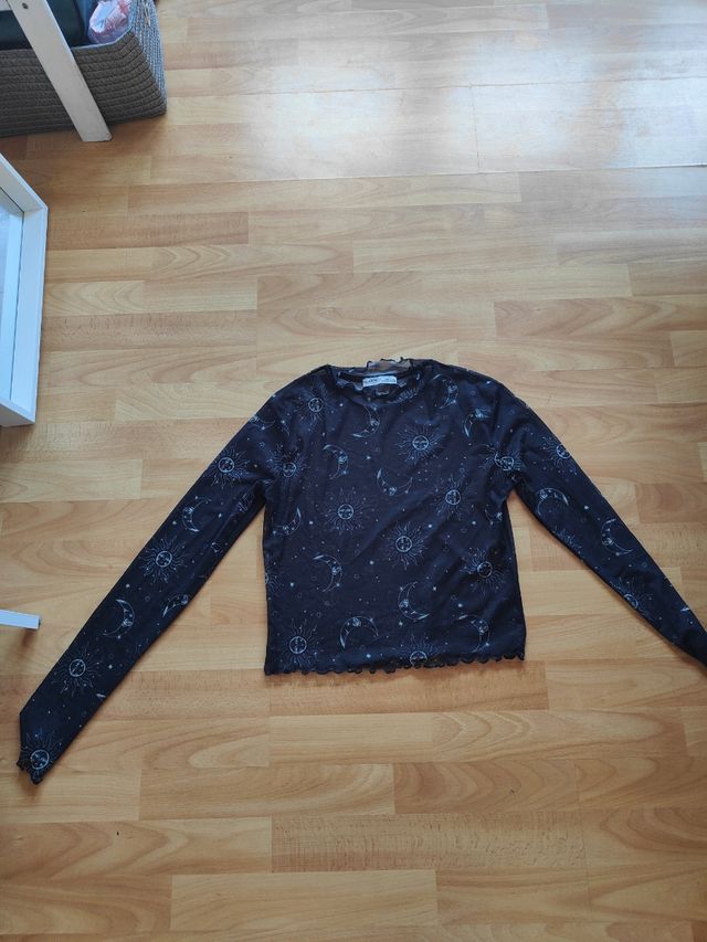 Blusa negra transparente constelaciones