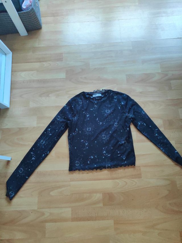 Blusa negra transparente constelaciones