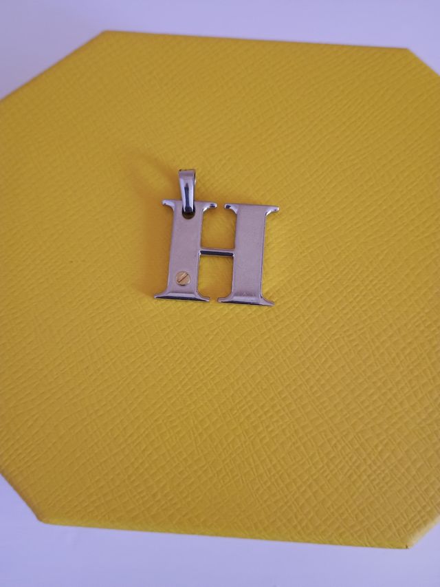 Colgantes acero-oro: H, V, Z